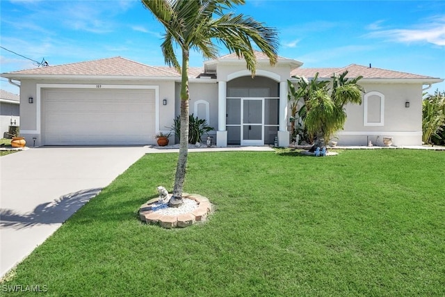 mediterranean / spanish house with stucco siding, driveway, roof with shingles, an attached garage, and a front yard