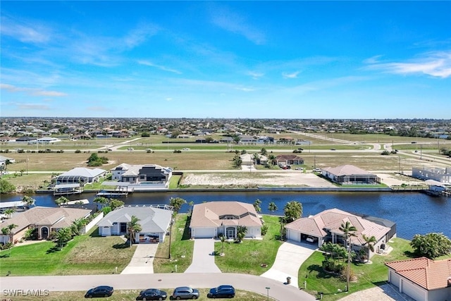 bird's eye view featuring a residential view and a water view