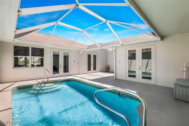 pool featuring french doors, a lanai, and a patio area