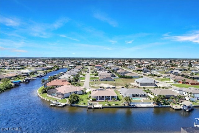 drone / aerial view with a residential view and a water view