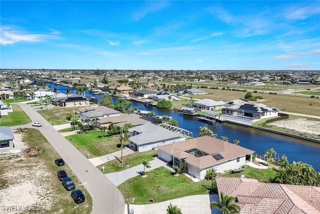 bird's eye view featuring a residential view and a water view