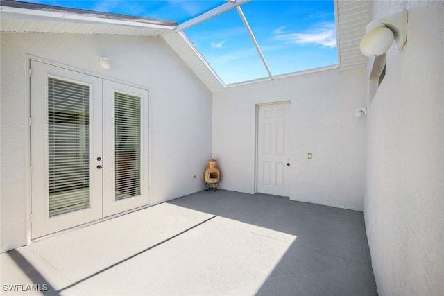 view of patio / terrace featuring french doors and a lanai