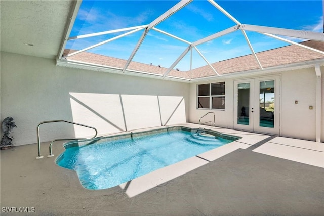 pool featuring a patio area, french doors, and a lanai