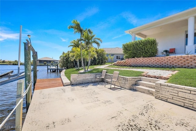 exterior space featuring a water view and a dock