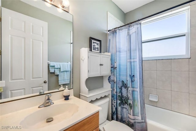 full bath featuring vanity, toilet, and shower / bath combo with shower curtain