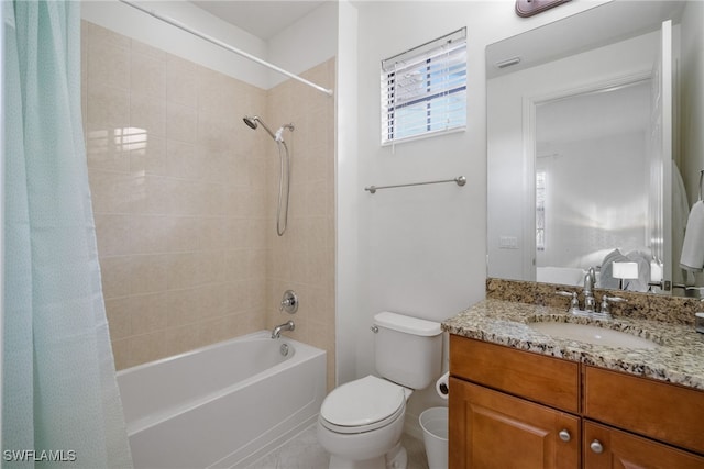 full bathroom featuring toilet, shower / bath combo with shower curtain, and vanity