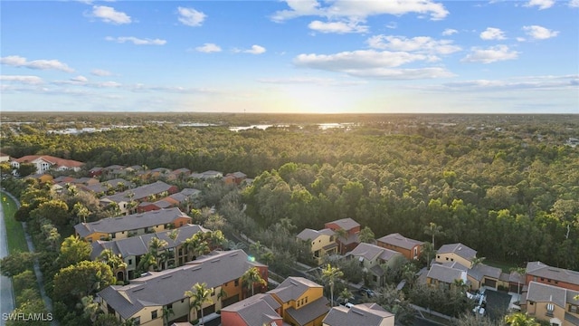 bird's eye view with a wooded view and a residential view