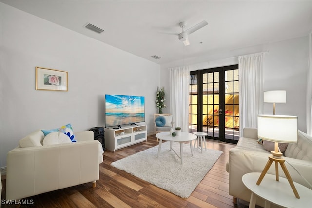 living area featuring french doors, wood finished floors, visible vents, and a ceiling fan