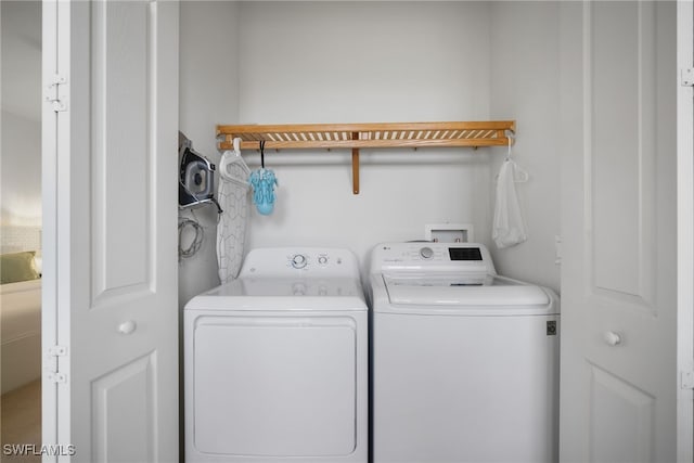 laundry area featuring laundry area and washer and clothes dryer