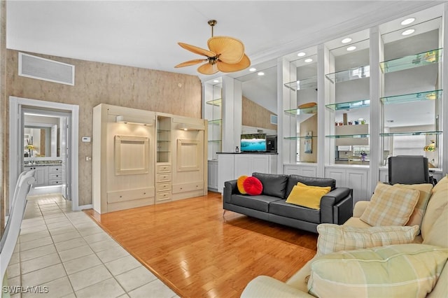 living area featuring a ceiling fan, light wood-type flooring, visible vents, and recessed lighting