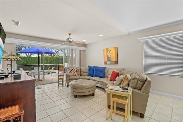 living area featuring recessed lighting, visible vents, light tile patterned flooring, ceiling fan, and baseboards