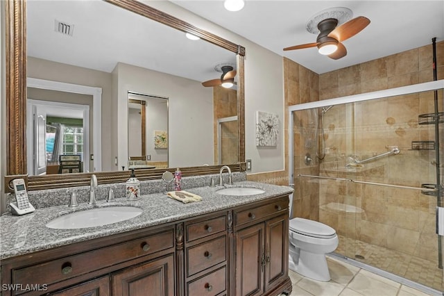 full bathroom featuring a stall shower, visible vents, a sink, and tile patterned floors