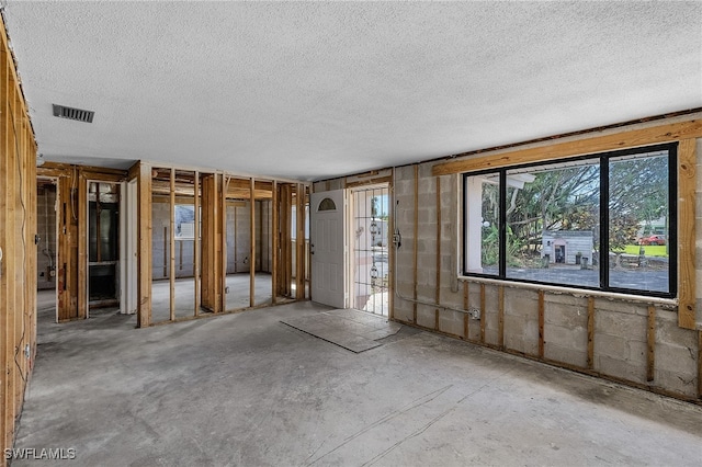 interior space with visible vents and a textured ceiling