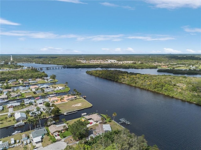 birds eye view of property with a water view and a residential view