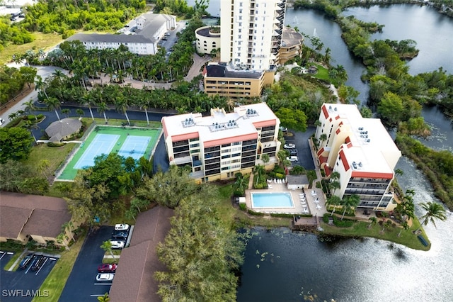 birds eye view of property with a water view