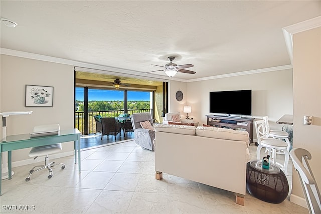 living area featuring ornamental molding, a textured ceiling, baseboards, and a ceiling fan