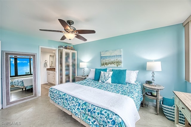 bedroom with ensuite bath and a ceiling fan