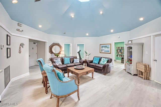 living area with light wood-type flooring, lofted ceiling, baseboards, and recessed lighting