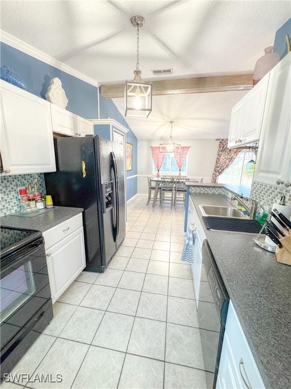 kitchen with tasteful backsplash, white cabinetry, vaulted ceiling with beams, and black appliances