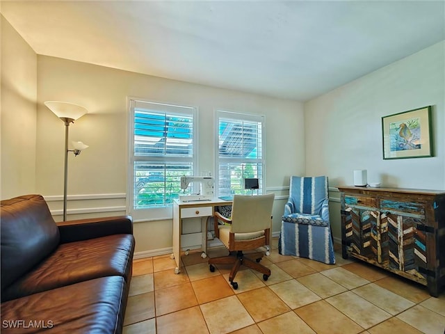 office with tile patterned flooring and baseboards