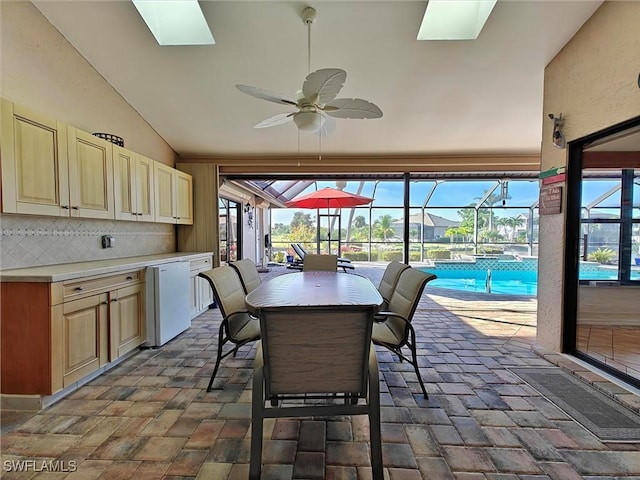 interior space featuring vaulted ceiling, a sunroom, and a ceiling fan