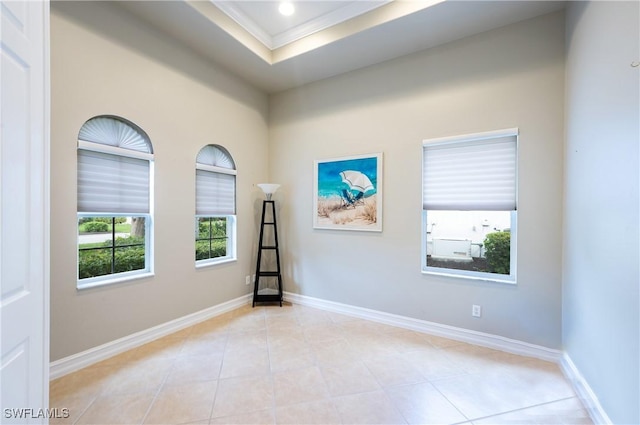 unfurnished room with light tile patterned floors, baseboards, a tray ceiling, crown molding, and recessed lighting