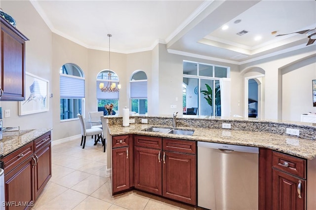 kitchen featuring crown molding, a sink, hanging light fixtures, and stainless steel dishwasher