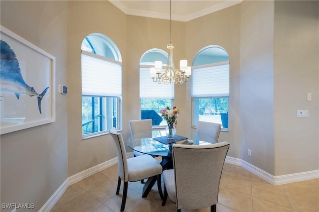 dining space featuring an inviting chandelier, baseboards, crown molding, and light tile patterned flooring