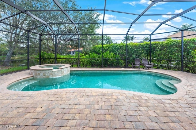 view of pool featuring glass enclosure, a patio, and a pool with connected hot tub