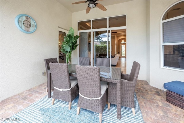 view of patio featuring outdoor dining space, visible vents, and ceiling fan