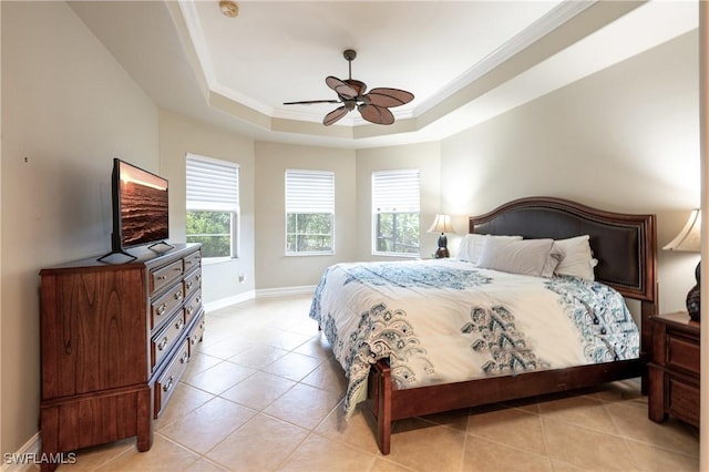 bedroom with crown molding, a raised ceiling, light tile patterned flooring, ceiling fan, and baseboards