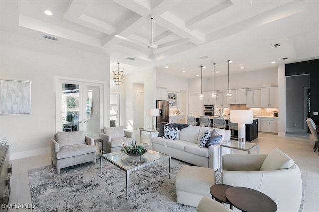 living room featuring baseboards, coffered ceiling, beamed ceiling, and a high ceiling