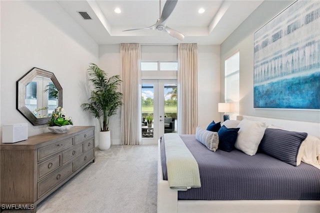 bedroom featuring access to exterior, french doors, visible vents, light carpet, and ceiling fan