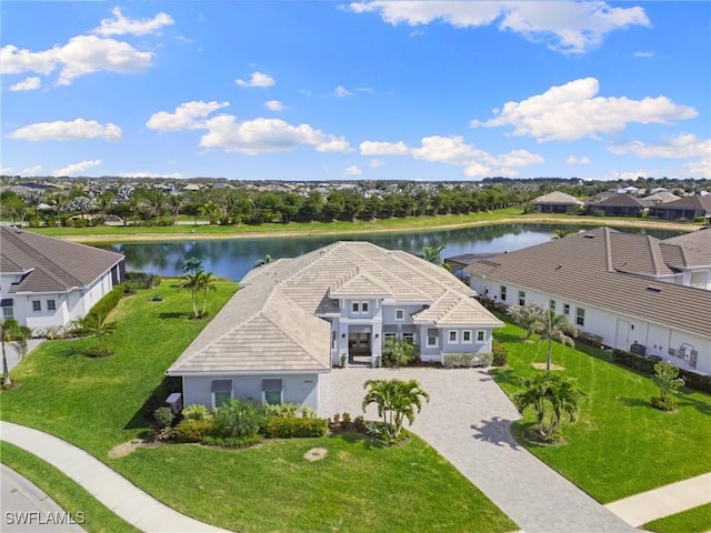 birds eye view of property with a water view