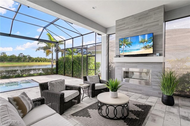 view of patio / terrace featuring glass enclosure, an outdoor living space with a fireplace, and a pool