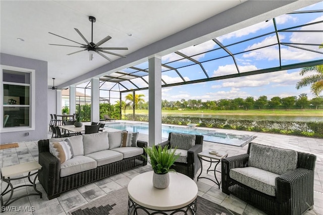 view of patio featuring a lanai, outdoor lounge area, and ceiling fan