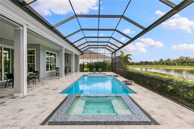 view of swimming pool with a water view, glass enclosure, a pool with connected hot tub, and a patio