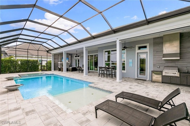 outdoor pool with area for grilling, ceiling fan, a lanai, exterior kitchen, and a patio area