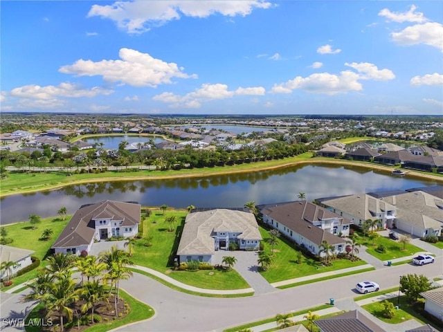 birds eye view of property with a residential view and a water view