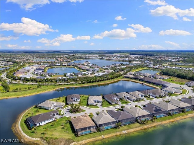 aerial view with a water view and a residential view