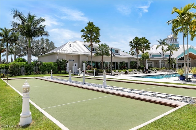 surrounding community featuring a yard and fence