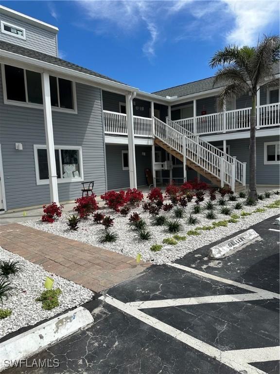 view of property featuring stairs