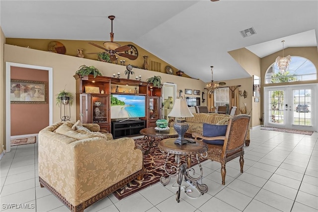 living area with light tile patterned floors, visible vents, a chandelier, and vaulted ceiling