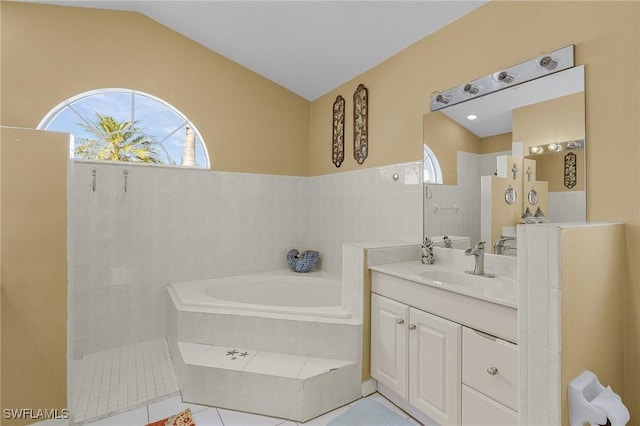 full bath with lofted ceiling, a garden tub, a walk in shower, and vanity