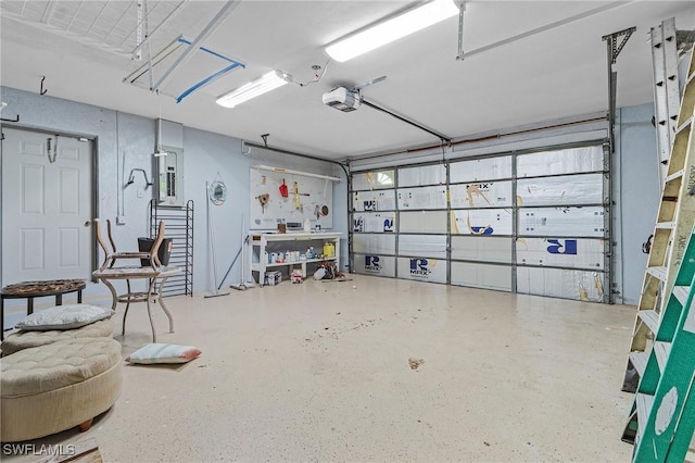 garage with electric panel and a garage door opener