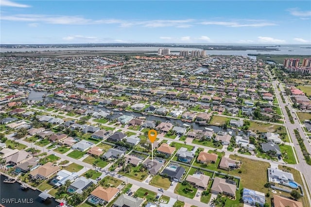 aerial view featuring a water view and a residential view