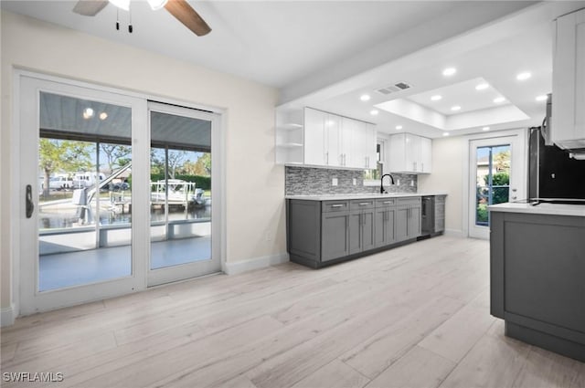 kitchen with wine cooler, visible vents, light countertops, backsplash, and open shelves