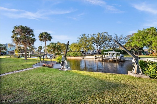 dock area featuring a yard and a water view