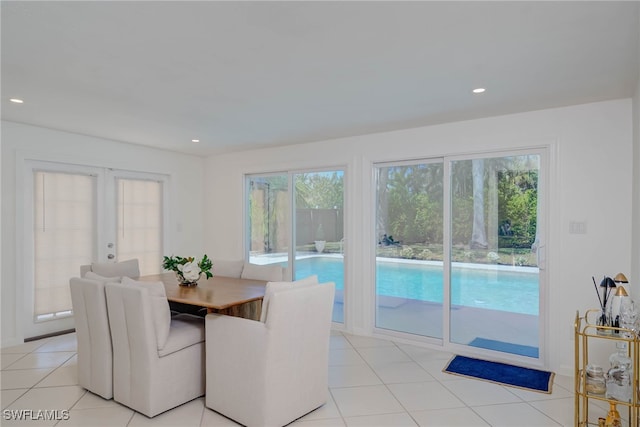 dining area with light tile patterned floors, french doors, and recessed lighting