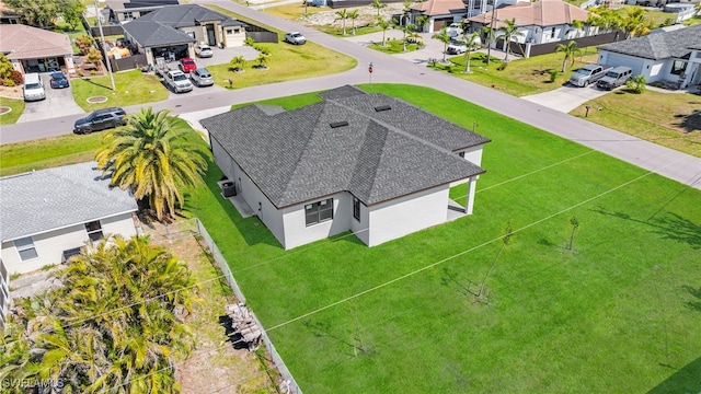 birds eye view of property with a residential view